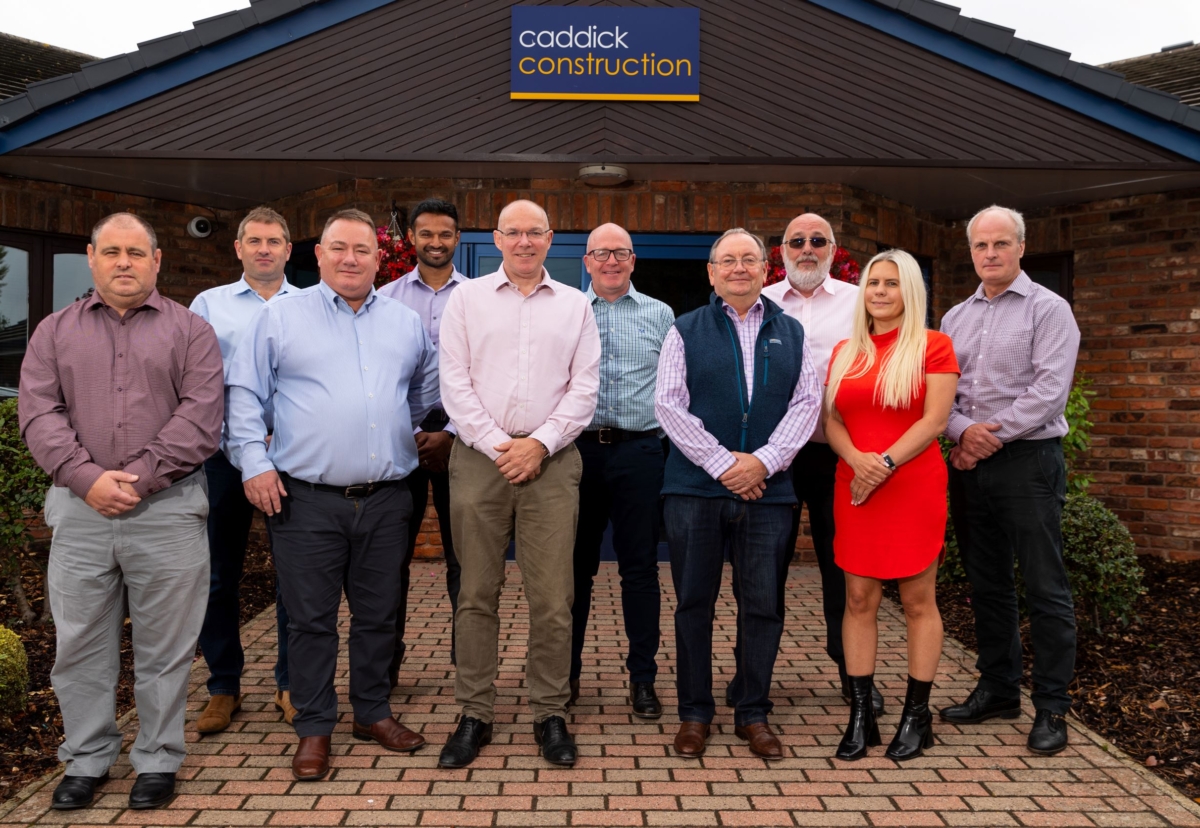 Members of the Caddick team with MD Paul Dodsworth (third from left) welcome their new colleagues.