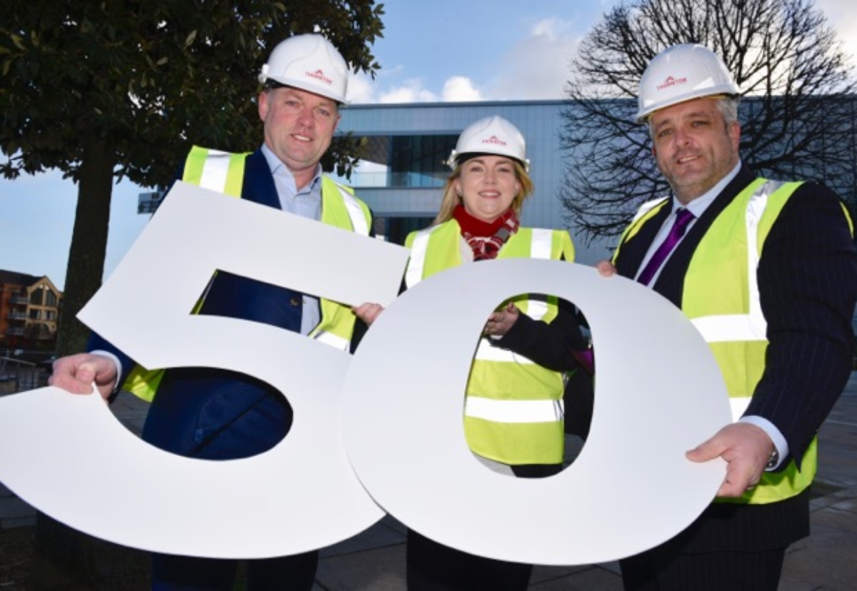 Stephen Thornton (Managing Director), Jenny Neeson (Finance Director) and Kenny Smyth (General Manager) celebrate the firm's 50th anniversary