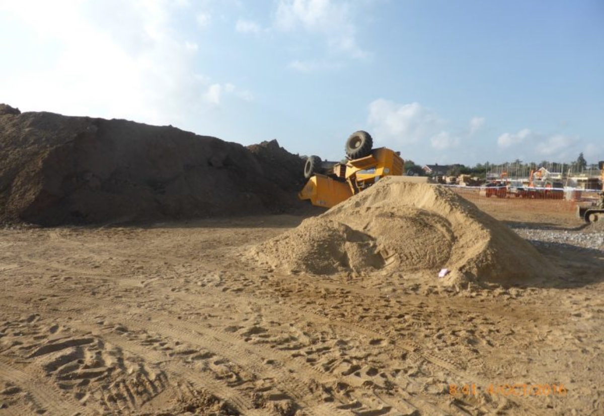 9t dumper truck overturned when at the top of a 12ft mound of soil at a housing site in Lawford