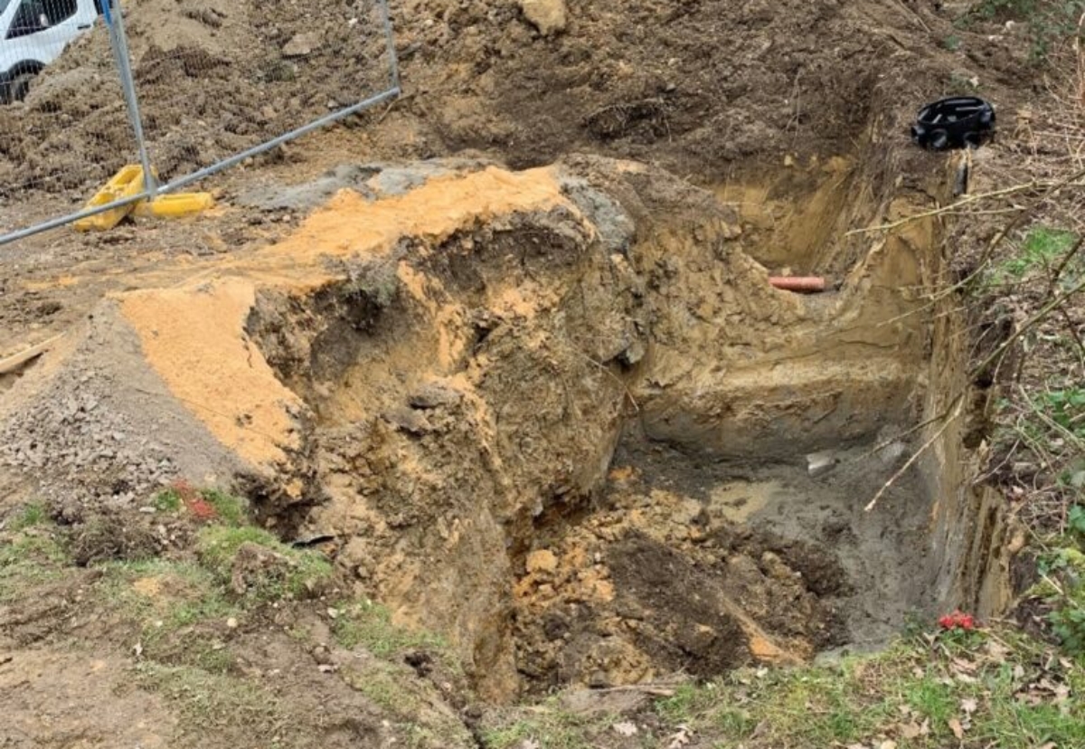 The three men were working in this excavation when it collapsed