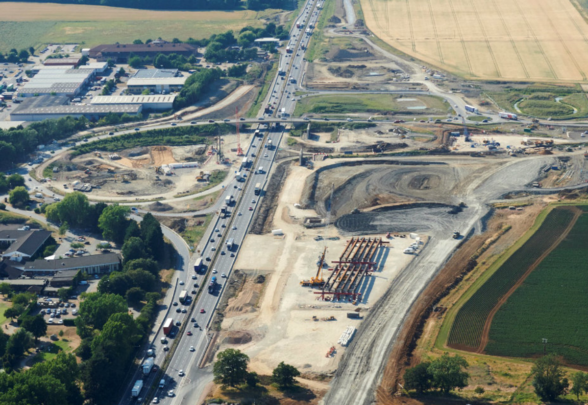 The abutments for the two new bridges can be seen just south of the existing bridge and further down on the right of the road, the bridge decks are under construction
