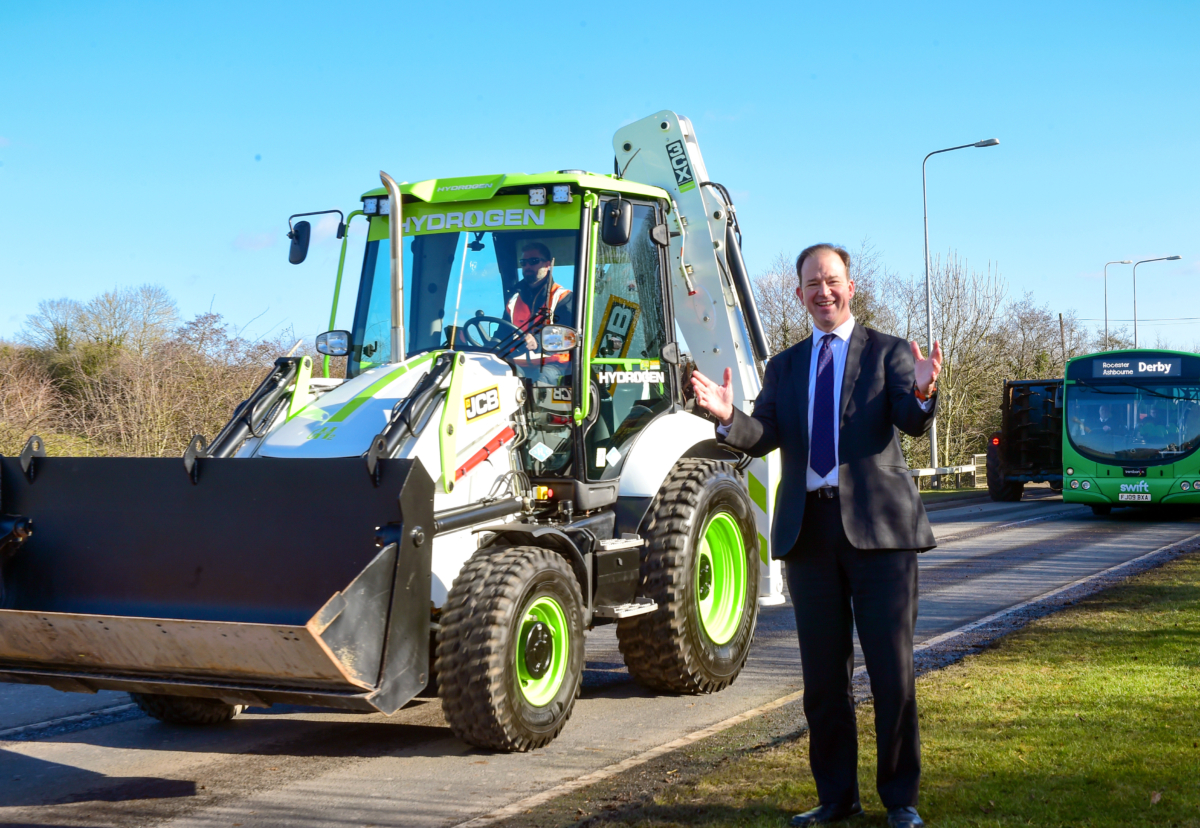 Technology and Decarbonisation Minister Jesse Norman pictured in Rocester, Staffordshire with a JCB backhoe loader powered by a hydrogen combustion engine