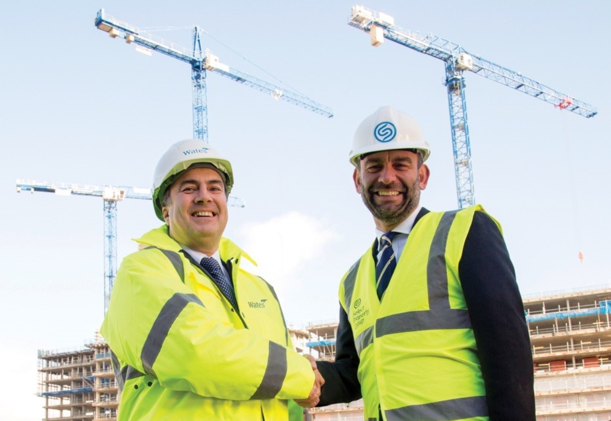 Phil Harrison, Wates Construction (L) and Mark Oakes, Select Property Group shake on multi site deal