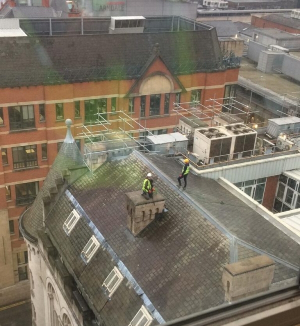 Public raise alarm over unsafe roof work high above Manchester