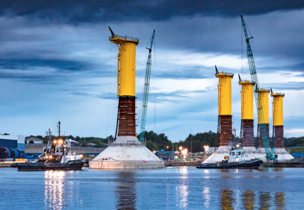 Gravity-based foundations constructed on the River Tyne are being floated out to sea to be submerged onto the seabed ahead of turbine installation