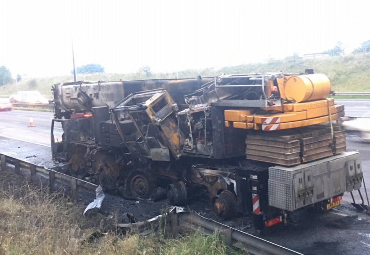 The burnt out crane was still being removed on Monday morning