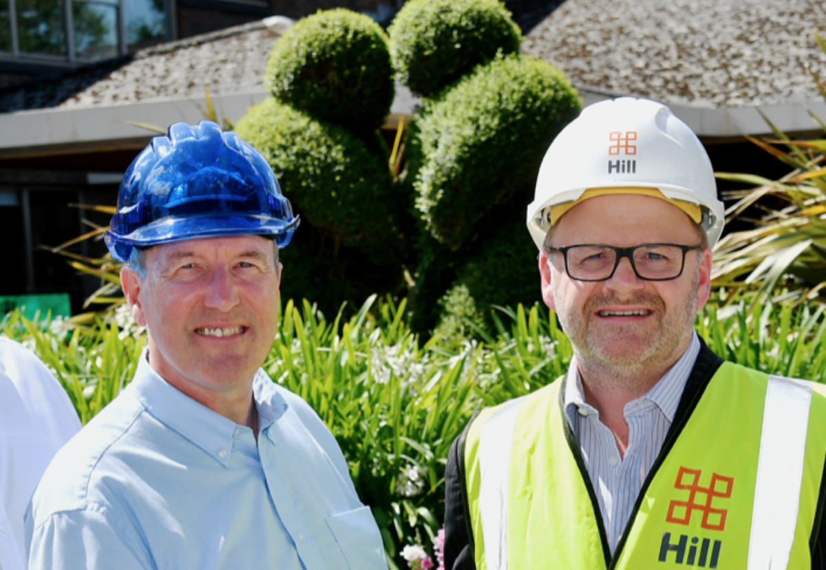 David Clifford, leader of Rushmoor Borough Council, seals deal with Neil Williams, Hill group finance director