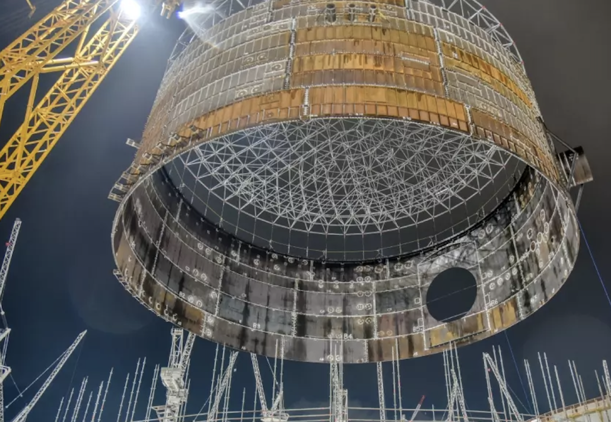 Prefabricated steel containment ring weighing 308 tonnes being lifted from construction bunker