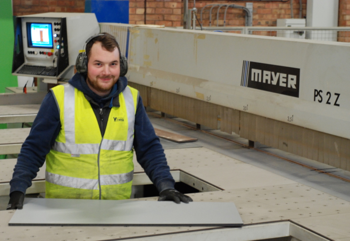 Sean Kelly, facilities manager of Vivalda Group, demonstrates the scale of the newly acquired cutting technology at the business’s Birmingham facility