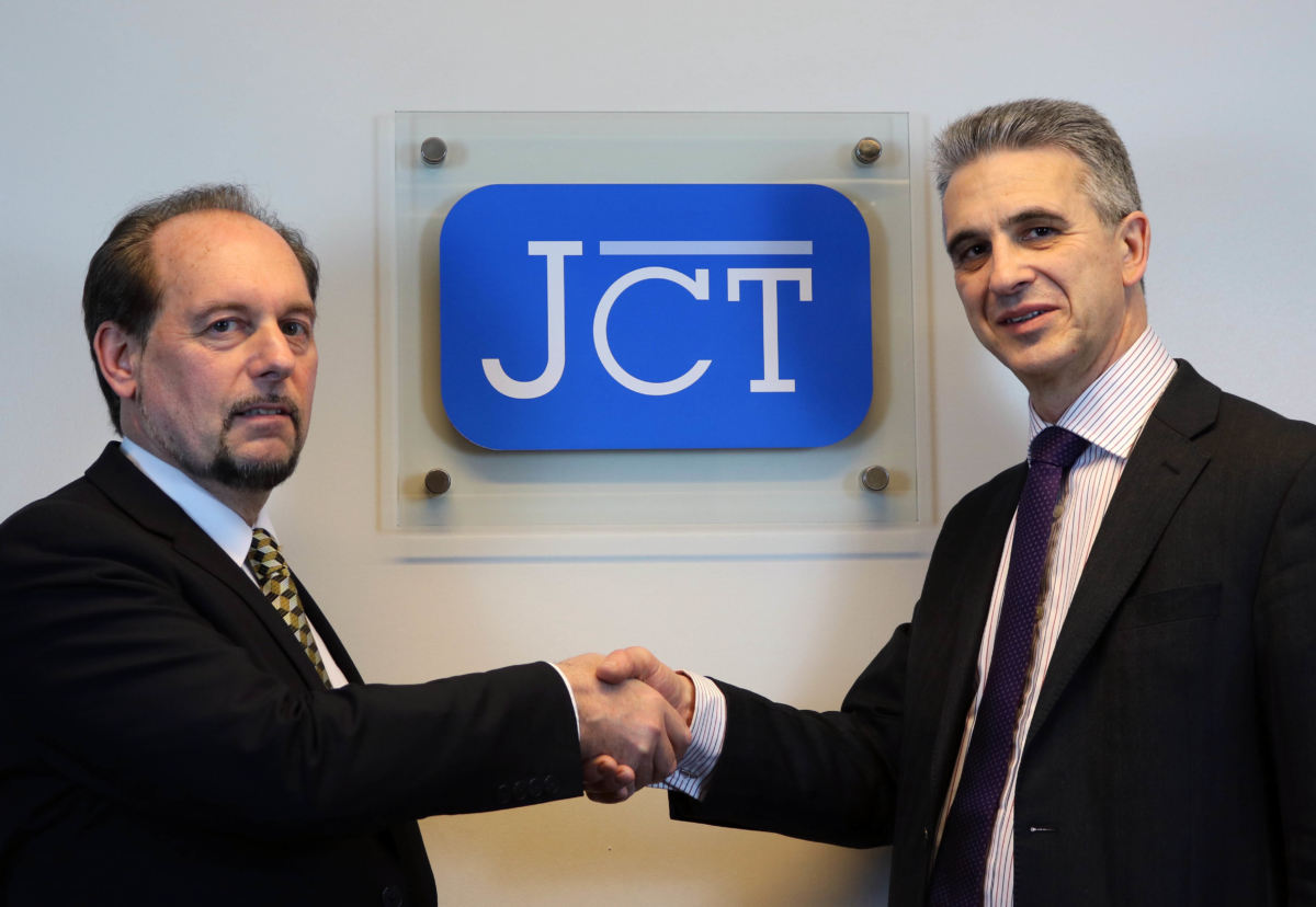 Neil Gower (L), JCT chief executive, with Arwel Griffiths (R), Met Office business group director