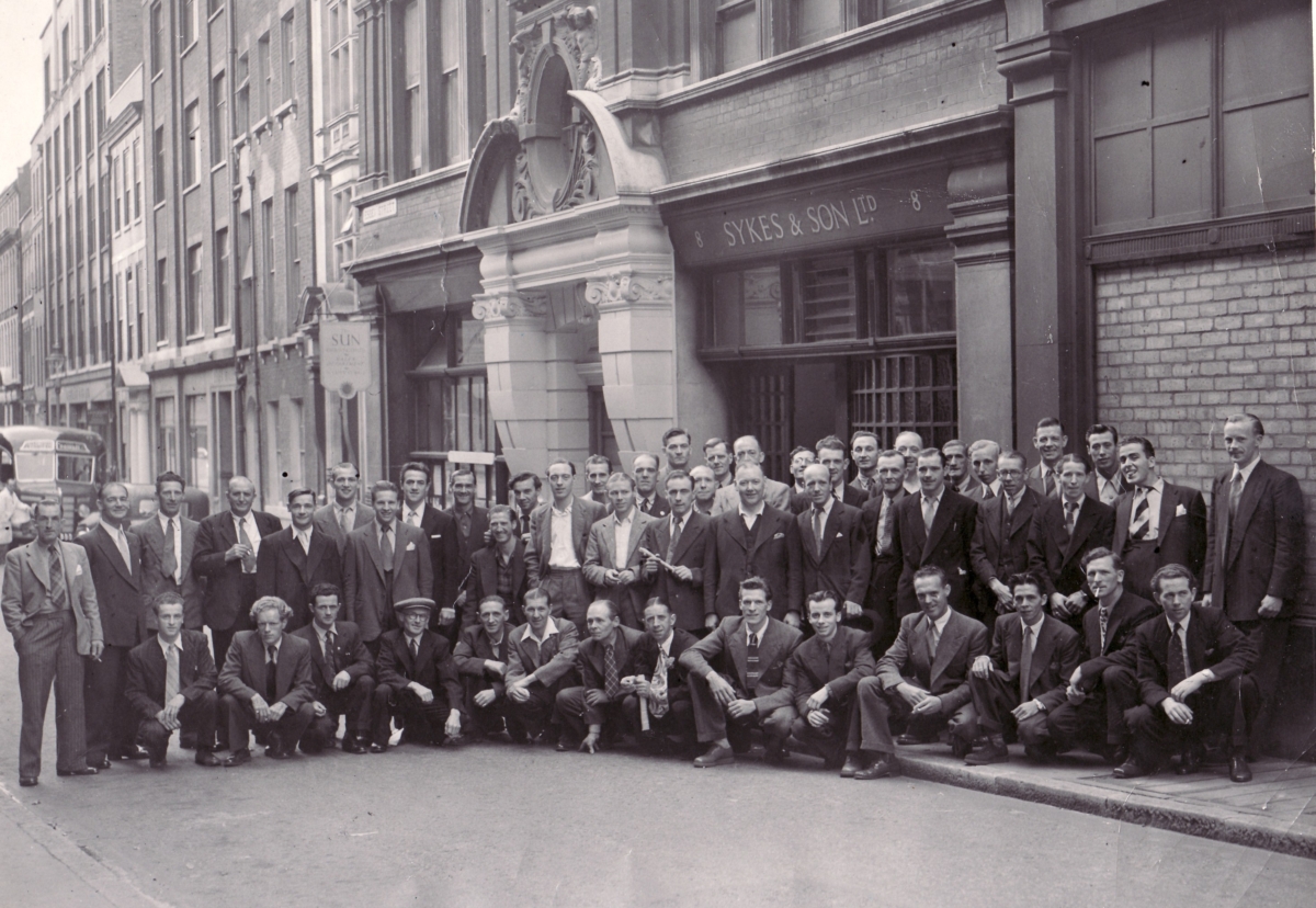 Staff outside Essex St office before a company day out in the 1950s