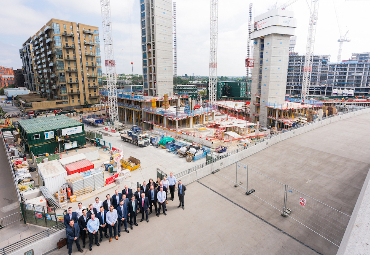 The Wates team in front of ongoing work at Wembley Park