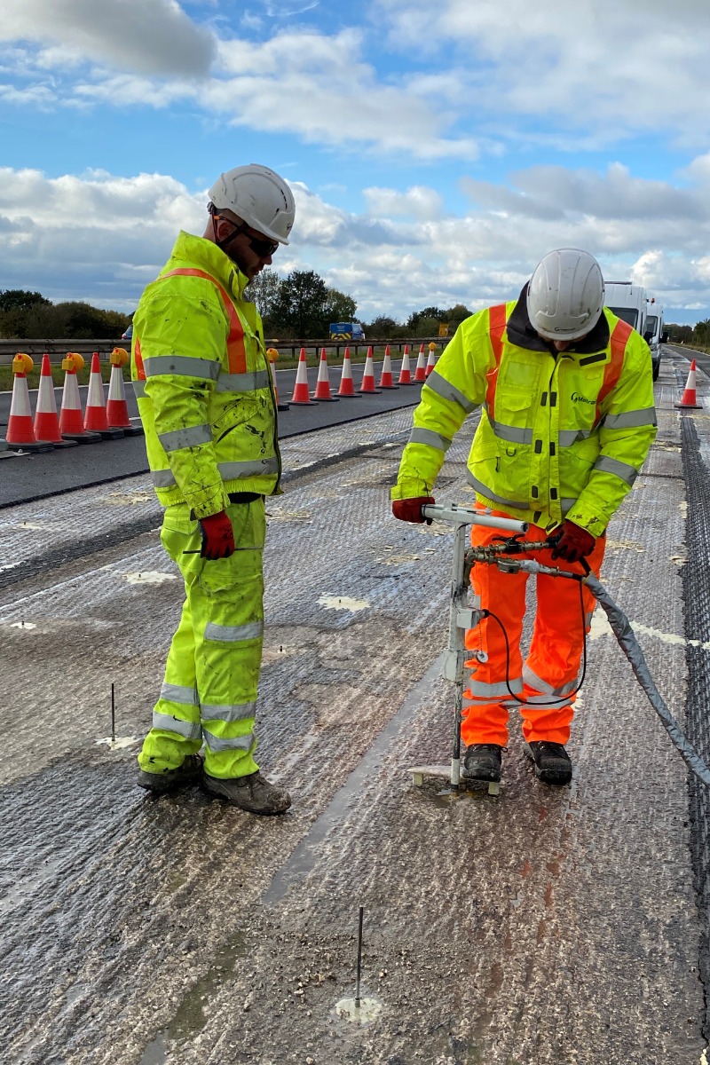 Workers are drilling more than 2,000 holes in road surface to inject resin