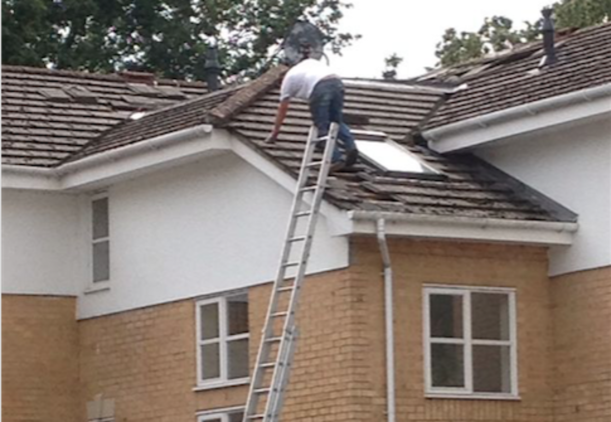 Colwell working on the rood without a scaffold